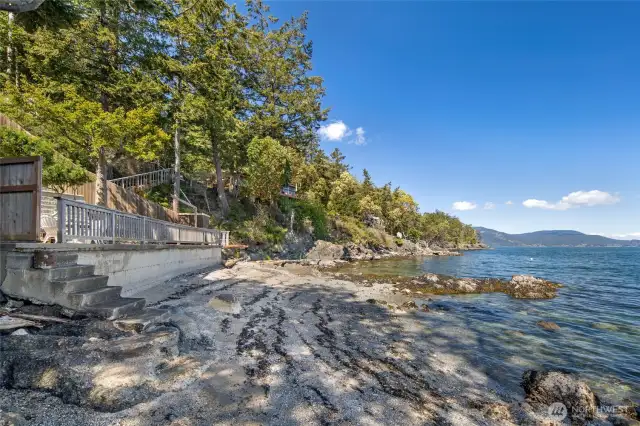 Concrete steps to the beach allow for easy access.
