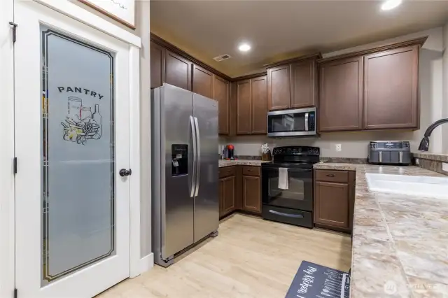 Nice details throughout the home, like the uplighting above the kitchen cabinets