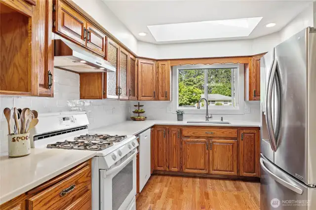 Quartz slab counters in kitchen.