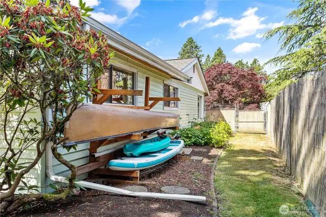 Additional storage space on north side of fenced backyard.