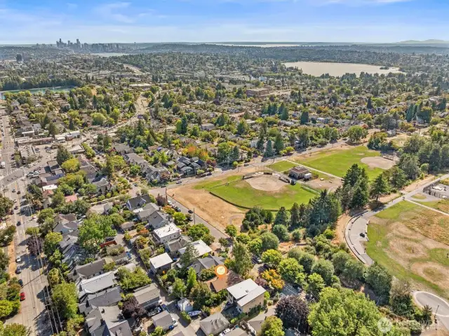 Aerial photo looking south and west. From this photo you can see Green Lake and downtown Seattle. Coveted Maple Leaf neighborhood. Only minutes to UW, Children's, downtown, Amazon and 520. Walking distance to light rail, cafes, restaurants and grocery stores.
