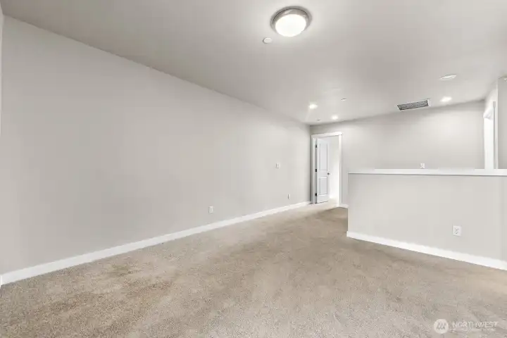 The upstairs loft works well as an office, den, or playroom.