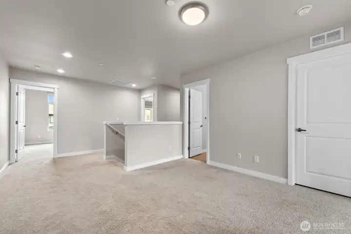The upstairs loft works well as an office, den, or playroom.