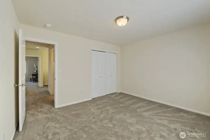 Another view of one of the upper level bedrooms (shows closet)