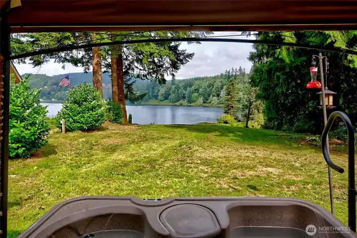 Hot tub time with a view of the lake and foothills