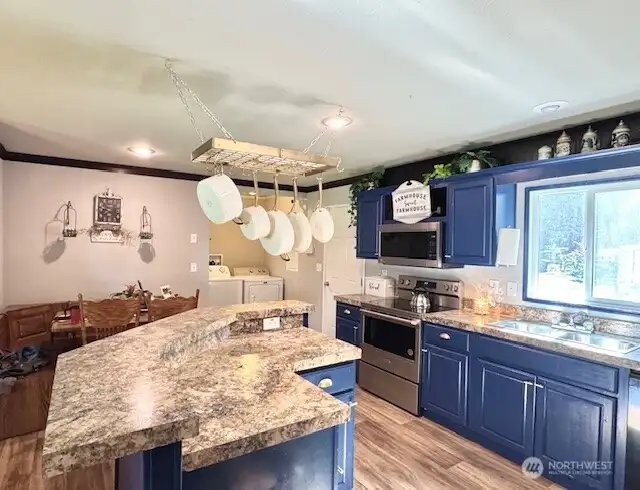 Main home kitchen island area with high top bar