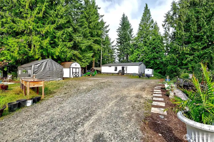 Closer view of main home, shed, garden space & property