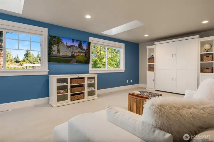 Versatile upper-level retreat ideal for a media room, guest suite, home office, or play area.