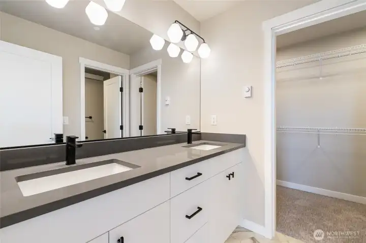 Primary ensuite looking towards walk-in closet pic for reference of like unit. 555 Northview is under construction.