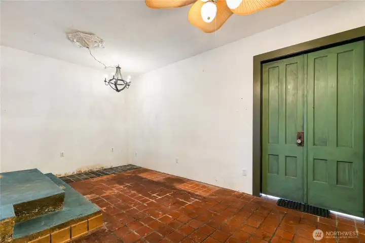 The old outdoor patio is now enclosed - indoor summer sitting area? Those green double doors to a little greenhouse