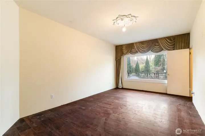 What used to be a garage, is now living space- Another large living room or generational living space? Through the door to the right is a bedroom and bathroom
