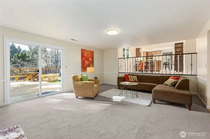 The super-sized family room entertains many furnishing plans with this one showing the gathering space and