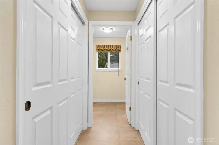 The lower hallway off the garage, family room and utility room offers two double wide pantry closets with shelving.  Costco ready!