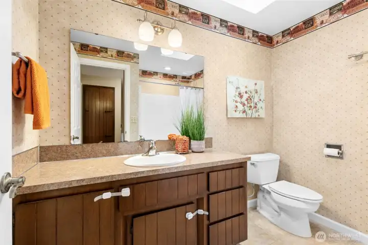 The full bath has a spacious vanity and tub/shower combination with updated plumbing and light fixtures.