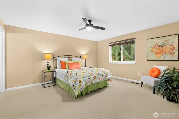 The large primary bedroom offers space for a king size bed and extra furnishings.  A quiet retreat at the back of the home overlooking the back yard.