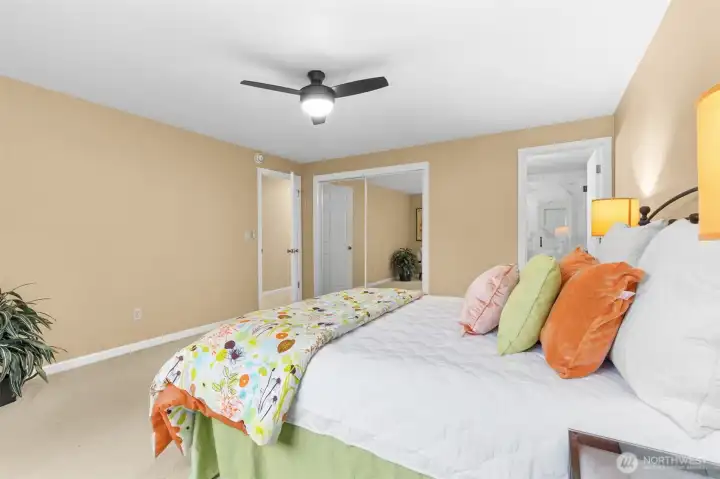 A generous primary closet is included in this large space that also has room for a wardrobe piece and more.  Ceiling fan helps the energy efficient heat pump circulation for heating and cooling.