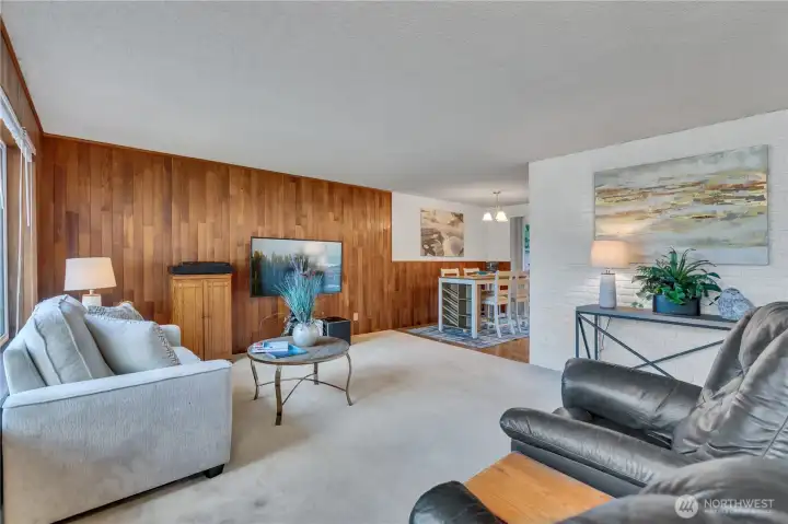 Living Room is open to dining area and adjoins cozy updated kitchen