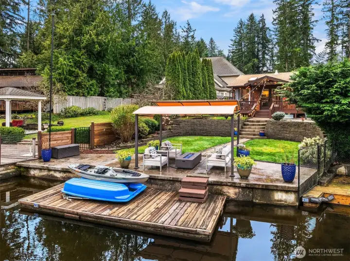 Custom stampcrete patio, mature landscaping, flat landscaped yard and ample space for all your toys.