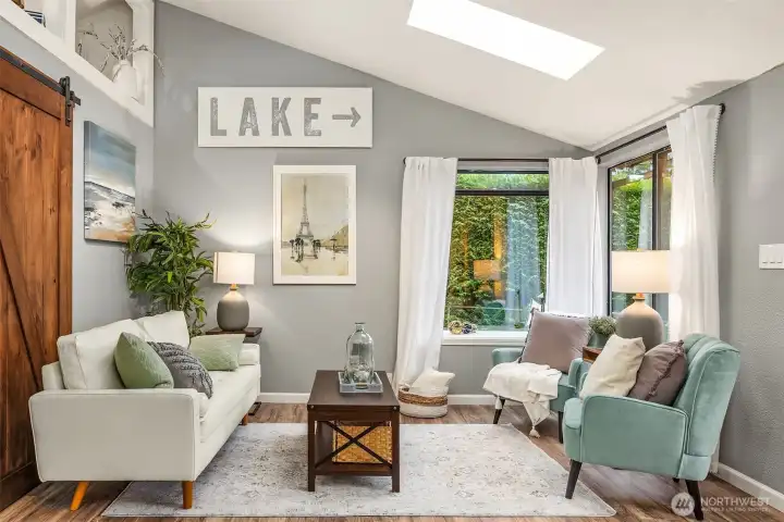 Vaulted ceilings and abundant windows make this cozy space live large.