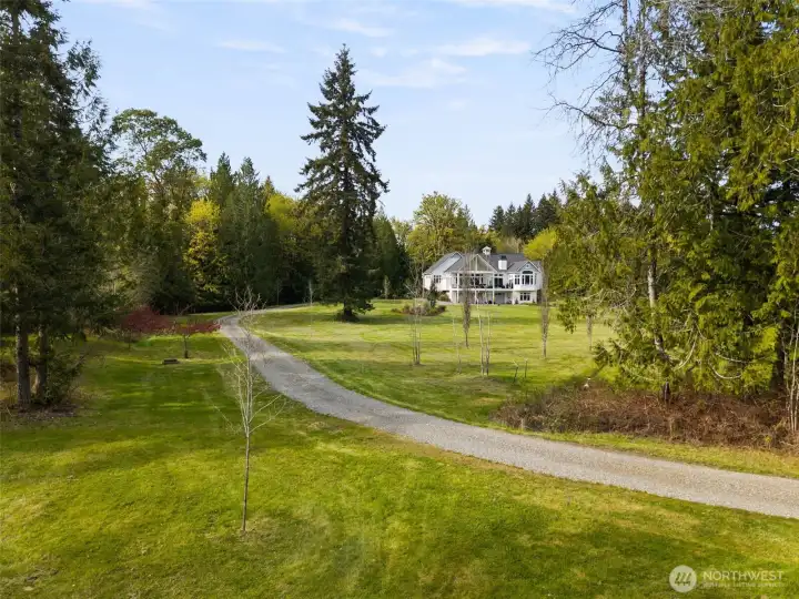 The home is set back from the road, and the drive to the home has that "wow" factor.