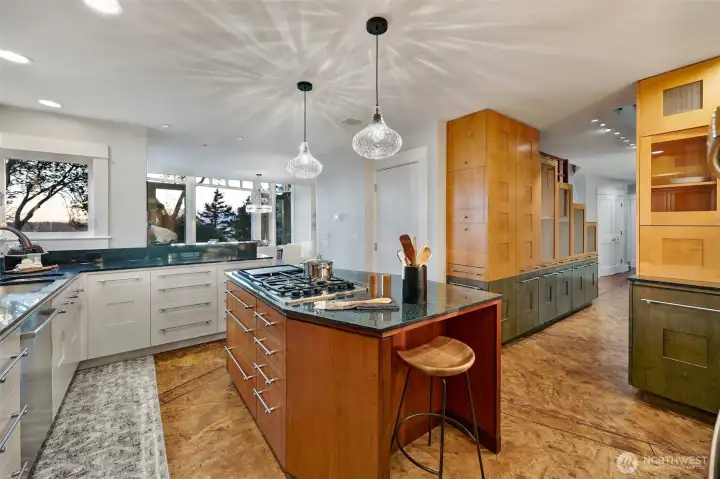 The kitchen sits behind the dining room and to the right you see the built ins that greeted you upon entry