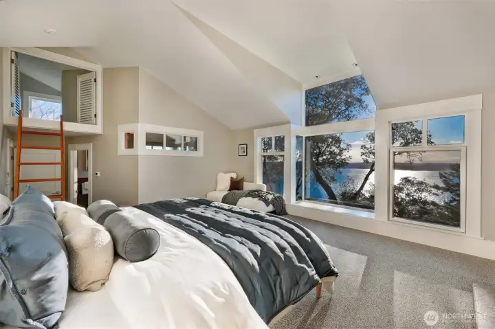 The ladder leads to a with a shed-roof dormer;  giving you high altitude views of the Olympic mountains and Puget Sound; The bird nest