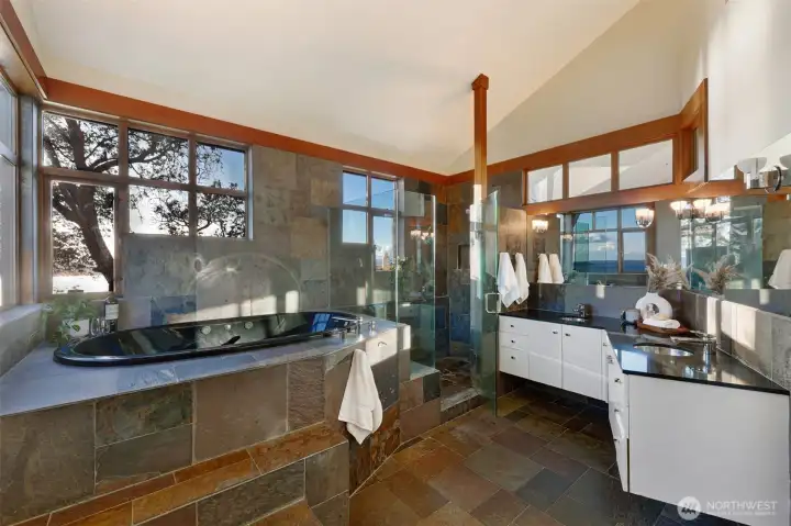 Primary bathroom, Slate accents, jetted tub, built in bench in the shower