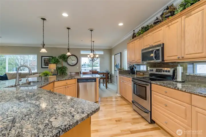 Premium stainless steel appliances and a functional, airy layout make this kitchen as practical as it is beautiful