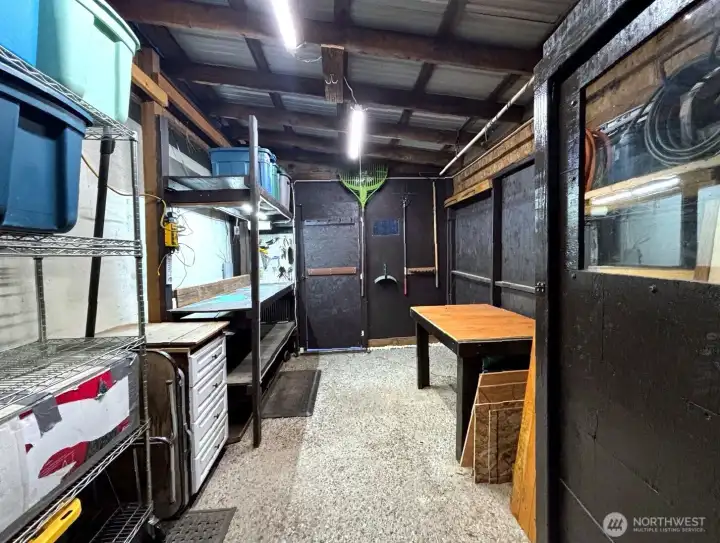 Detached workshop/storage area.  carport in which can be converted back if one desires.