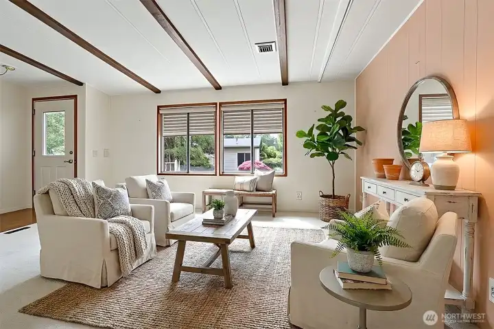 Formal living room with vaulted ceilings and western exposure.  Virtually staged photo.