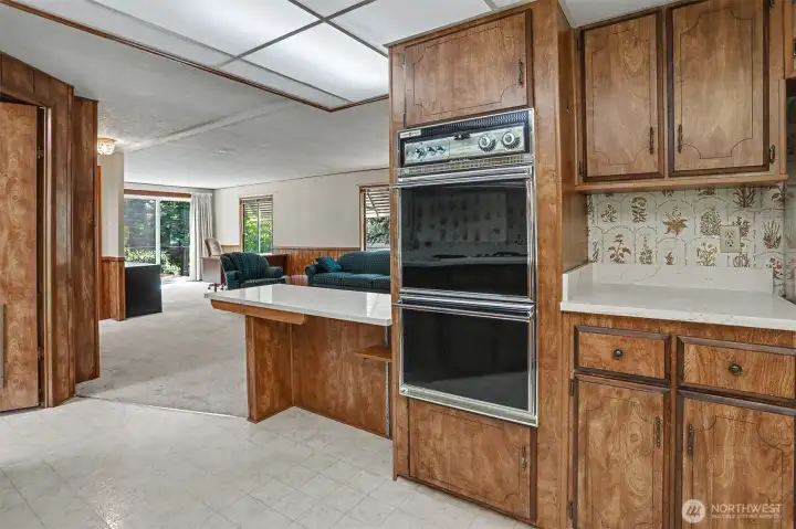 Spacious kitchen with quartz counters, eating bar that opens to family room.