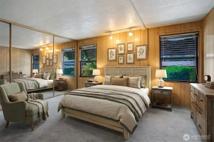 Master bedroom suite with a remodeled 4 piece bathroom with a full length walk  in shower.  Virtually staged photo.
