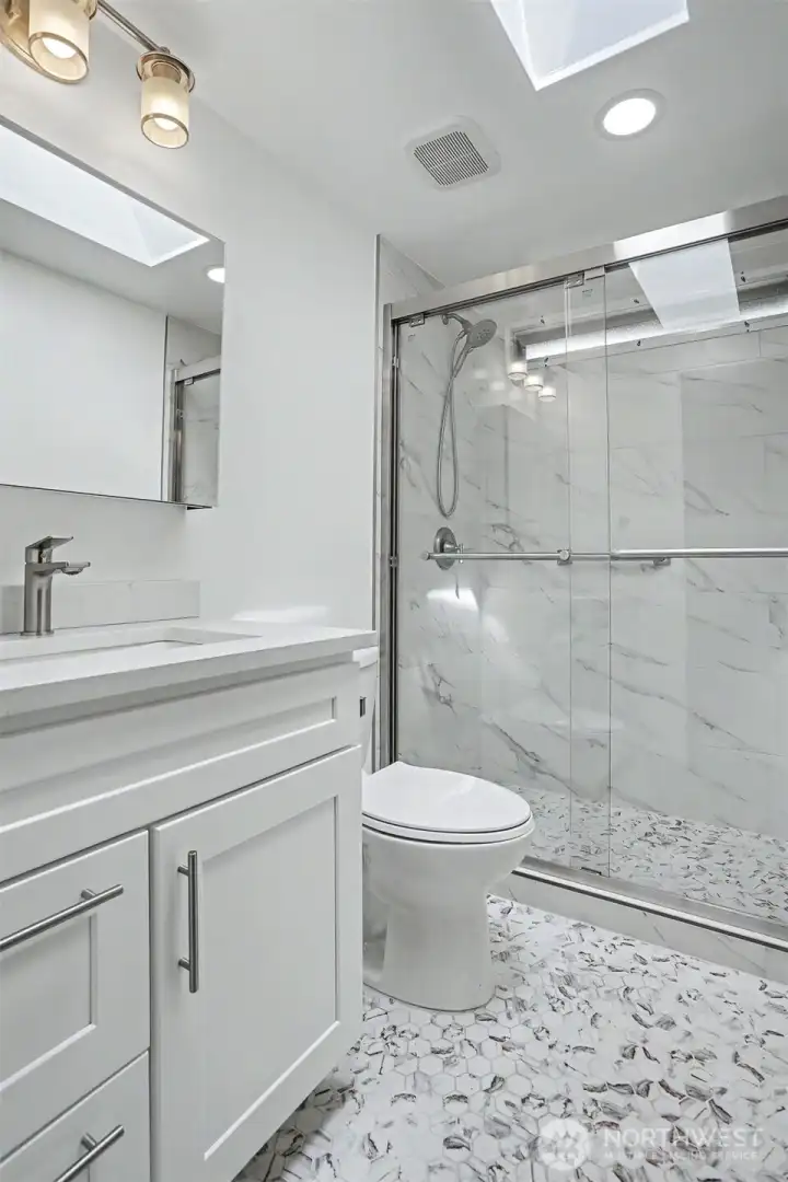 Remodeled 2nd bathroom with a full length walk in shower.