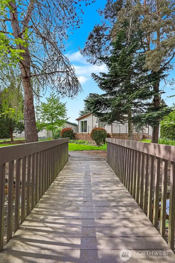 View of home from the bridge over the community creek.