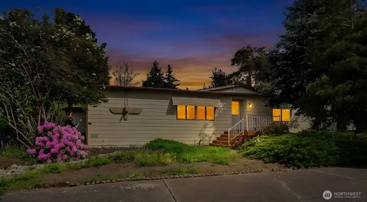 Twilight formal front entry view.  Virtually staged photo.