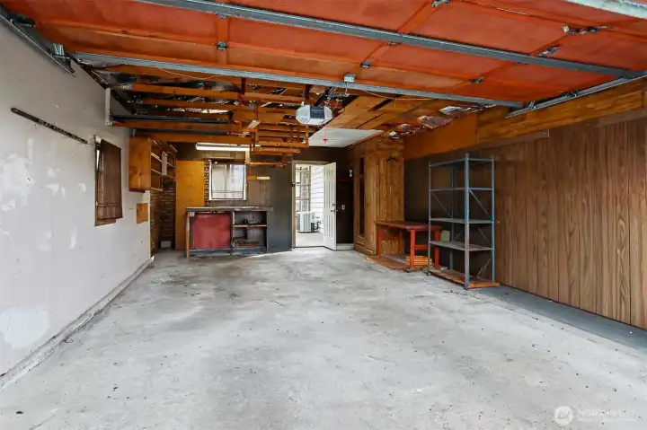Detached 2 car garage with 2 uncovered driveway parking spaces.