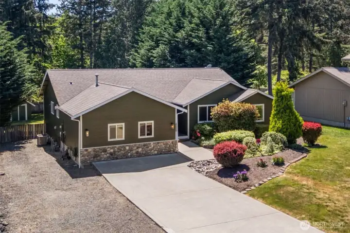 Fresh exterior paint sets off this one-level PNW beauty on a .34-acre lot just 5 minutes from the Allyn waterfont. And space for your RV!