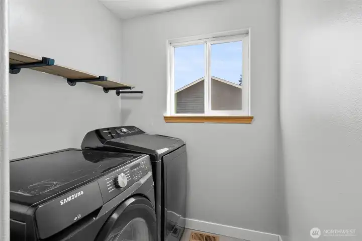 Bright laundry room conveniently off the kitchen.
