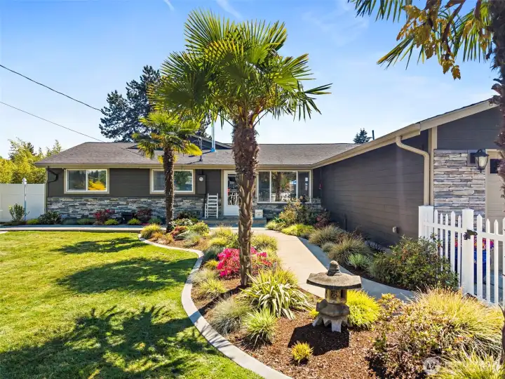 Large water fountain/feature tucked in beautiful landscaping near front walkway. Easy access to light rail, the airport, I-5, and just minutes from Downtown & Des Moines Marina.
