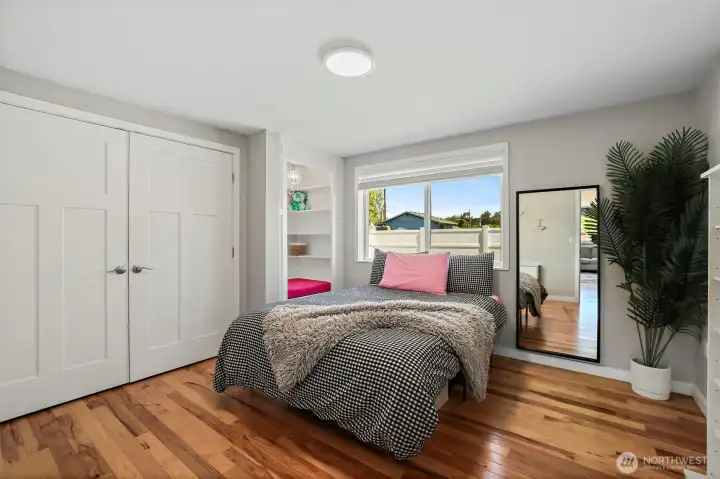 Oversized bedrooms with  shelves and closet organizing systems in 2nd bedroom