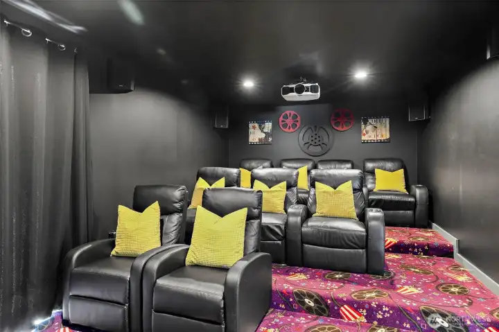 Movie Room with tiered theater seating (all theater furniture and electric equipment stays)