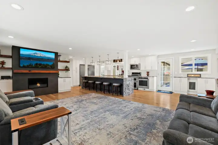 Open Floor Plan. Gas Fireplace. Connected Family Room. Custom floating wood shelving in living room and primary bedroom.