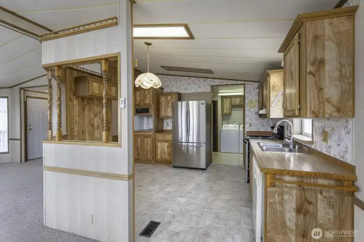 Step into a large Kitchen with eating space. All appliances stay with the home!