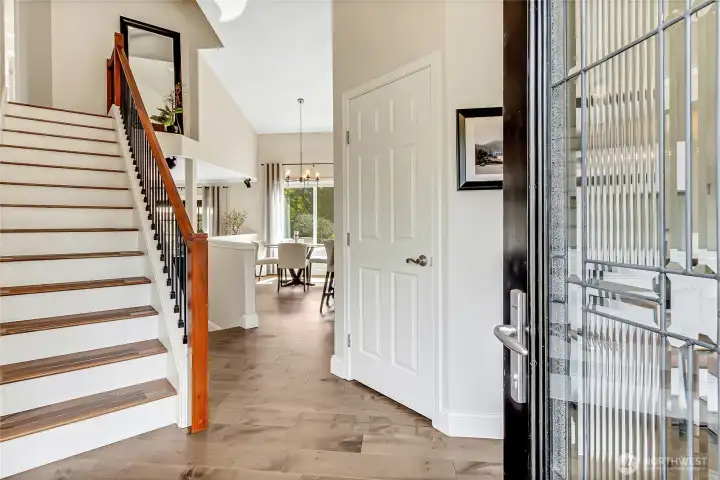 Step through the front doors into a welcoming foyer featuring rich hardwood floors, soaring ceilings, and a stunning staircase that sets the tone for the homes elegant design. Step through the front doors into a welcoming foyer featuring rich hardwood floors, soaring ceilings, and a stunning staircase that sets the tone for the homes elegant design.