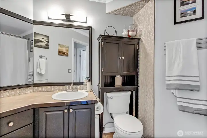 A well-appointed full bath is conveniently located between bedroom 2 and 3, providing comfortable accommodations for family members and guests alike. A well-appointed full bath is conveniently located between bedroom 2 and 3, providing comfortable accommodations for family members and guests alike.