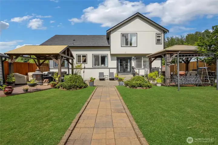 Enjoy the perfect blend of privacy and comfort in this beautifully landscaped backyard, highlighted by the home's attractive facade and outdoor entertaining spaces. Enjoy the perfect blend of privacy and comfort in this beautifully landscaped backyard, highlighted by the home's attractive facade and outdoor entertaining spaces.