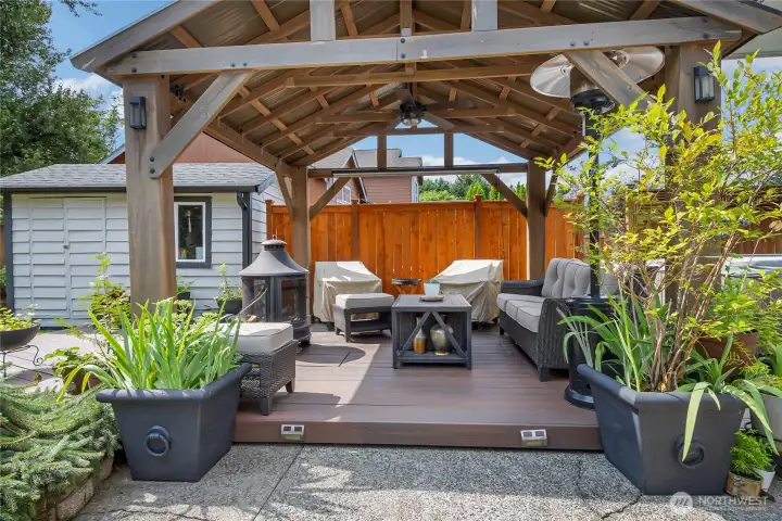 Complementing the backyard's multiple entertaining spaces, a covered seating area with an outdoor rated remote controlled fan and situated close to the hot tub, offers a peaceful retreat. Nearby, a large powered shed provides abundant storage and flexible space for yard equipment, hobbies or recreational equipment. Complementing the backyard's multiple entertaining spaces, a covered seating area with an outdoor rated remote controlled fan and situated close to the hot tub, offers a peaceful retreat. Nearby, a large powered shed provides abundant storage and flexible space for yard equipment, hobbies or recreational equipment.