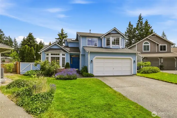 Wide view of the front yard and exterior showcasing mature landscaping and the welcoming presence of this Covington single family home. Wide view of the front yard and exterior showcasing mature landscaping and the welcoming presence of this Covington single family home.