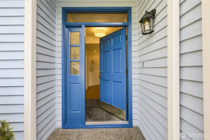 Covered front entry with a colorful front door creating a warm first impression and sheltered access year round. Covered front entry with a colorful front door creating a warm first impression and sheltered access year round.