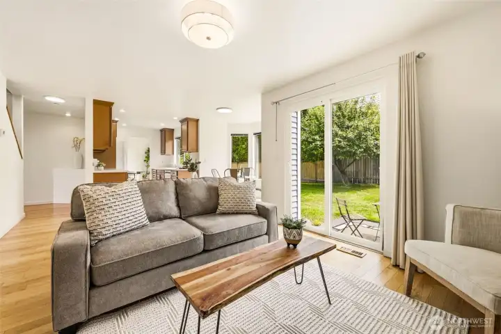 Additional family room perspective highlighting indoor and outdoor connectivity through sliding glass doors leading to the backyard. Additional family room perspective highlighting indoor and outdoor connectivity through sliding glass doors leading to the backyard.
